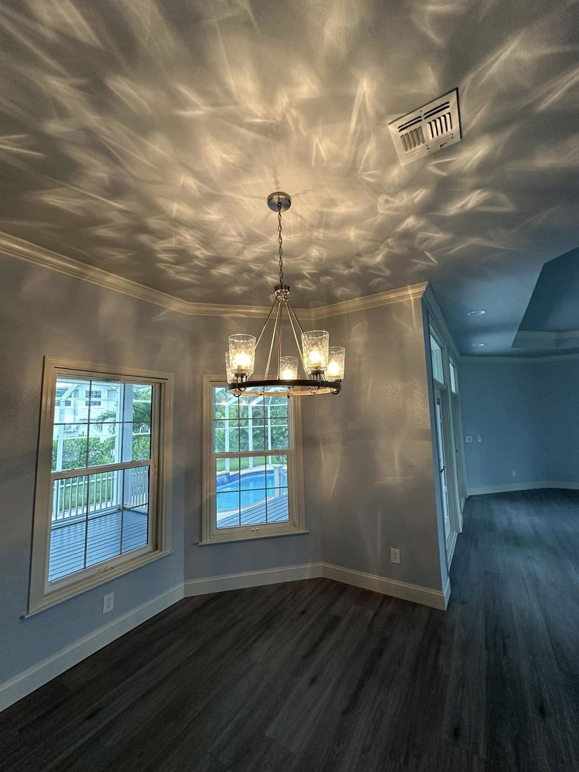 Dining room with statement lighting